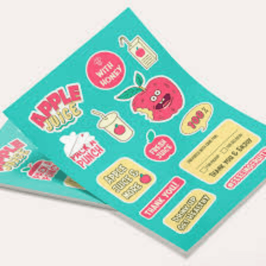 Sheet of colorful stickers with various designs on a teal background